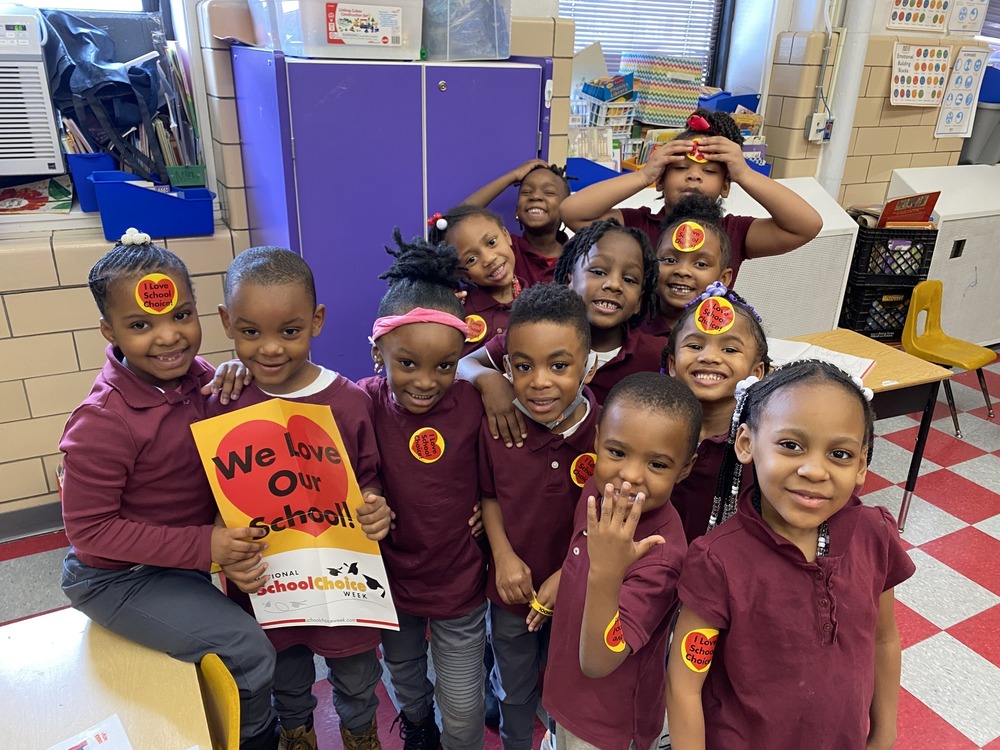 Students smiling with National School Choice Week stickers