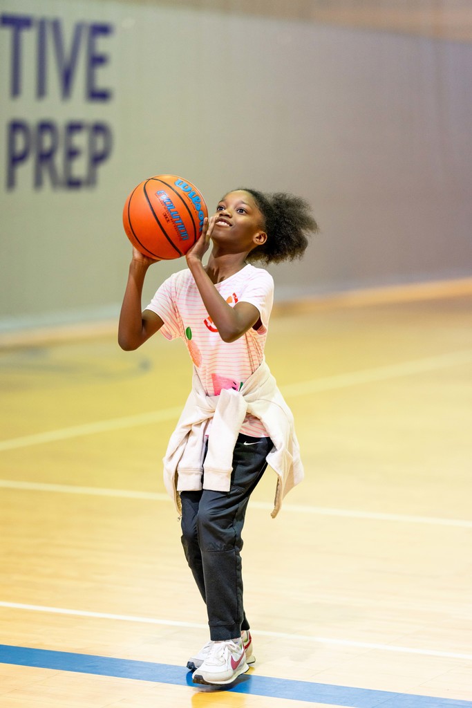 student playing basketball