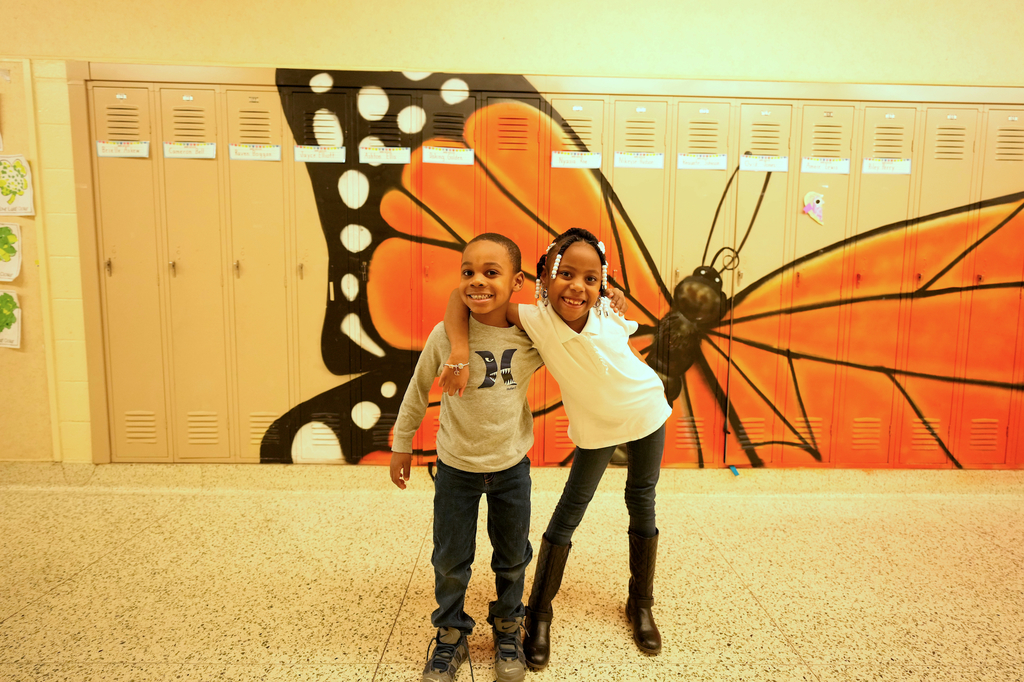 Students in front of locker mural